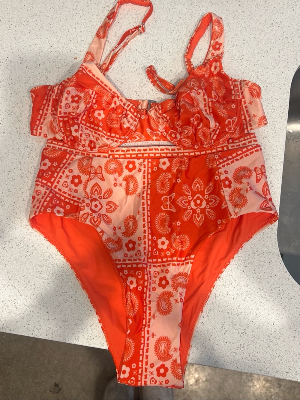Woman’s Light Pink and Orange Printed Swim Suit